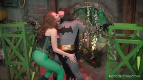 Poison Ivy uses her hypnotic pheromone powers to seduce the Batman  