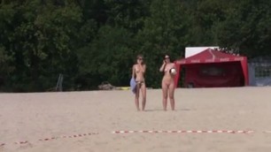 GIRLS PLAYING BALL ON NUDE BEACH