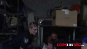 A black dude gets hard fucked by two blonde cops that want his massive cock inside their wet pussies