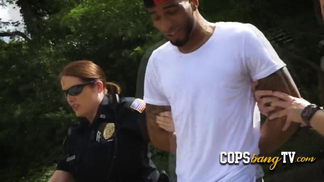 Horny MILFs are teaching a black suspect a lesson with their wet pussies.