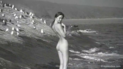 Teen Anya having fun naked in a beach
