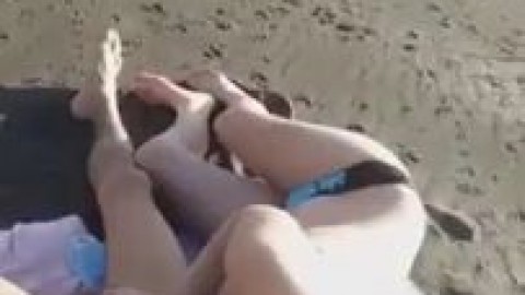 Teen gives blowjob on beach