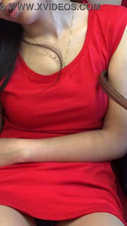 Daring upskirt of s. asian chick in red dress on the train
