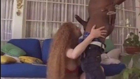 Fiery redhead Annie T. Body gets her ginger pussy fucked by a black stud's big cock until she squirts