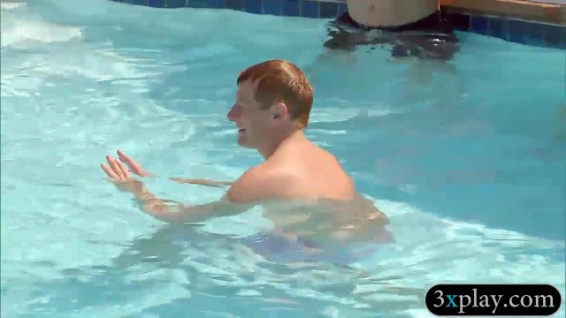 Group of swingers having fun by the pool