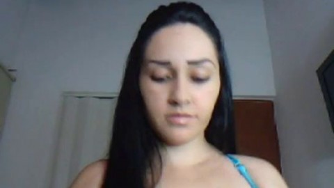 Latina with huge tits strips and dances on webcam