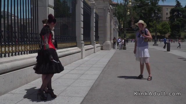 Slave with butt plug paddled in public