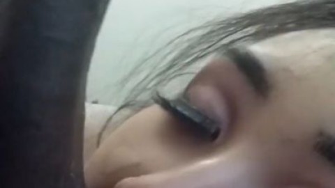 Eva Yi stuffs black balls in her mouth