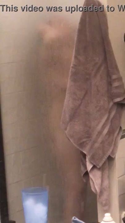 Spy on a hot milf taking a shower