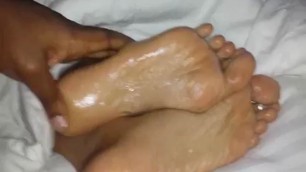 Oiled wifes foot filmed up close