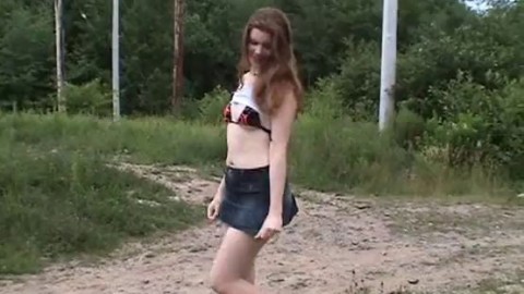 Geeky jean skirt redhead flashing in public park