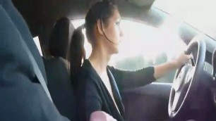 Stunning lady strokes cock while driving