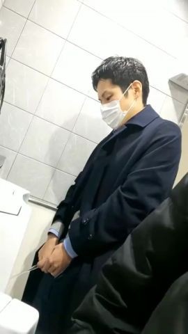 Males are pissing in the toilet 2.