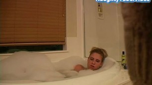Hidden cam catches hot blonde fingering herself in the bath tub.