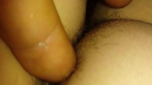 Fingering a hairy pussy and having fun with the anus
