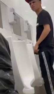 A male is pissing in the toilet 29.