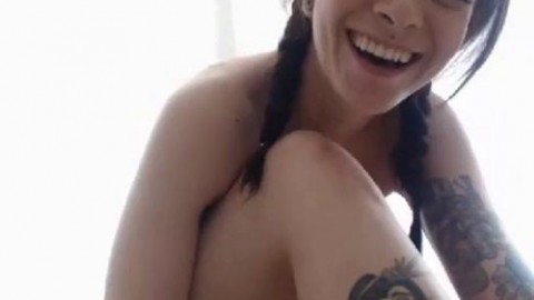 tattooed nude girl with nipple piercing gets her ass spanked