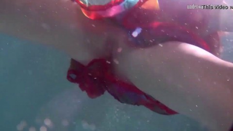 Redhead b. Nikita Vodorezova gets naked fast underwater