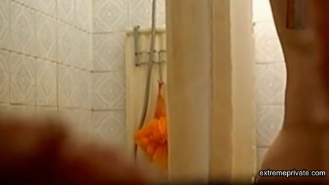 Peeping on Stepmom as she showers (hairy pussy)