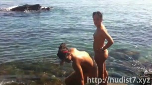 Nudist female with big clit nude on beach voyeur cam