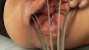 Wire whisk stretches her vagina cunt closeup